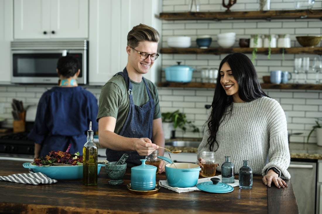 Family enjoying a modern kitchen with built-in stainless steel appliances