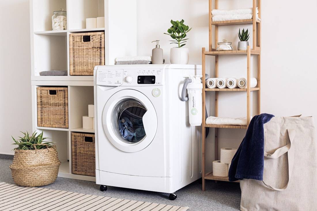 Front-load washing machine in a clean modern laundry room — washer repair Schreiner TX